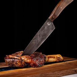 CUT132 - Tomahawk Ribeye served medium rare! Careful, we play with our knives.