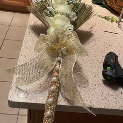 Dollar Tree - This is a Broom I made for my wedding ceremony and all the items that took to decorate the broom were from the Dollar Tree.