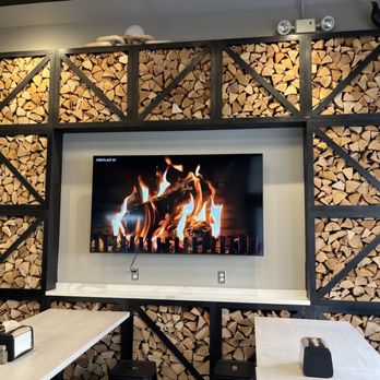 Taboonette - a flat screen television mounted on a wall - Mediterranean Near Me - Brooklyn, New York