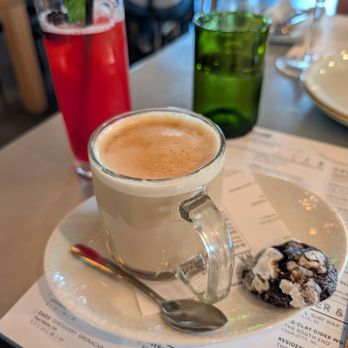 Sixty Vines - Vanilla latte, comes with a soft cookie for dipping! - New American Near Me - Charlotte, North Carolina