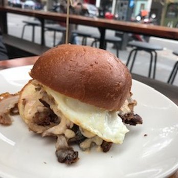 Curio - Breakfast sandwich w/ egg, fried pork belly and decadent pimento cheese - Bars Near Me - San Francisco, California Curio - Breakfast sandwich w/ egg, fried pork belly and decadent pimento cheese - Bars Near Me - San Francisco, California