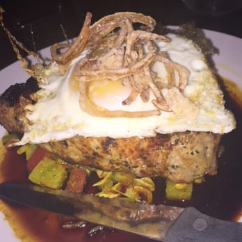 Flying Pig Pub & Kitchen - Pork chop with optional fried egg. - Pubs Near Me - Oceanside, California
