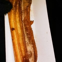 De Lola - De Lola, Seville -- dulce de leche churro   (yes I am wearing gloves, it was COLD out!)