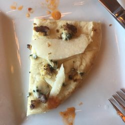 Ty's Fine Foods - 1/4 of the pear walnut and blue cheese flat bread with a few drops of sauce from sharing cabbage rolls.