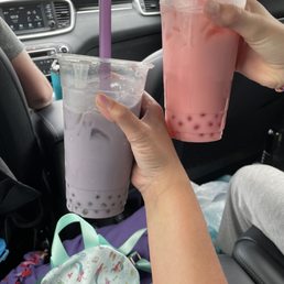 Taro tea with kiwi popping bubbles and strawberry tea with strawberry popping bubbles.