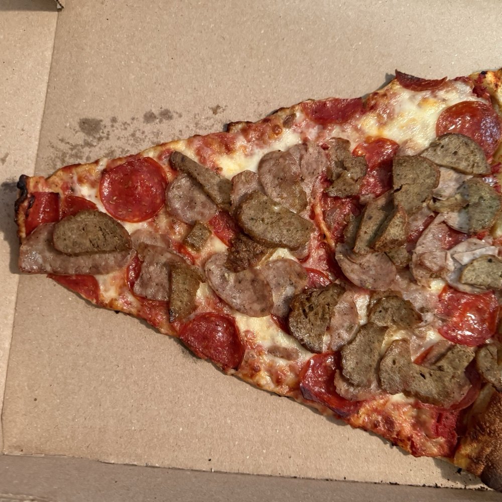 The Corner Crust Pizza And Brew - Meat Lovers slice - Pizza Near Me - Kannapolis, North Carolina The Corner Crust Pizza And Brew - Meat Lovers slice - Pizza Near Me - Kannapolis, North Carolina