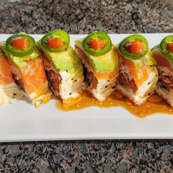 Ami Sushi - Mr. Castro roll I can't tell you everything that's in it, but it does not have rice and was absolutely delicious!! - Sushi Bars Near Me - Santa Ana, California