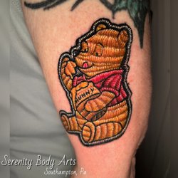 Serenity Body Arts - Winnie the Pooh embroidery tattoo in Southampton, Pa Bucks County