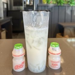 OCha Tea Corner - These little bottles are Yakult, a popular Asian yogurt drink. This is an OCha Lychee Yakult drink with Lychee jelly.