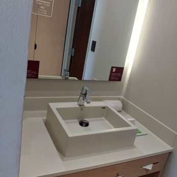 City Express Suites - Sink area for bathroom with poor lighting - Hotels Near Me - Playa del Carmen, ROO