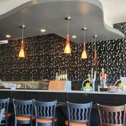 Option for one to sit at the sushi bar.