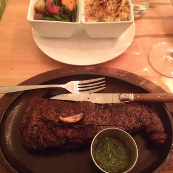 Rennick Meat Market - Ny strip with a chimichurri on the side, roasted veggies, and bacon mac n cheese. - Steakhouses Near Me - Ashtabula, Ohio Rennick Meat Market - Ny strip with a chimichurri on the side, roasted veggies, and bacon mac n cheese. - Steakhouses Near Me - Ashtabula, Ohio
