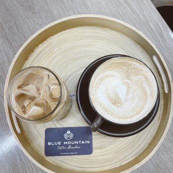 Blue Mountain Coffee Roasters - Left: Iced caramel latte | Right: Hot vanilla latte - Coffee & Tea Near Me - Suwanee, Georgia Blue Mountain Coffee Roasters - Left: Iced caramel latte | Right: Hot vanilla latte - Coffee & Tea Near Me - Suwanee, Georgia