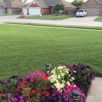 Bare Foot Turf - What a wonderful view. Beautiful flowers and plush green grass. Go BareFoot Turf! - Lawn Services Near Me - Yukon, Oklahoma Bare Foot Turf - What a wonderful view. Beautiful flowers and plush green grass. Go BareFoot Turf! - Lawn Services Near Me - Yukon, Oklahoma
