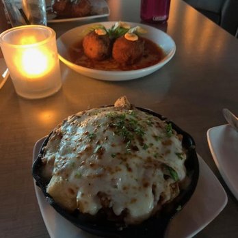 Society - Bolognese fries up front, Arancini balls by the candle, meatballs in the back - Italian Near Me - Tempe, Arizona