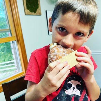 Sebastian Bakehouse - An extremely happy 8 yo enjoying Sebastian Bakehouse pastries - Bakeries Near Me - Cincinnati, Ohio