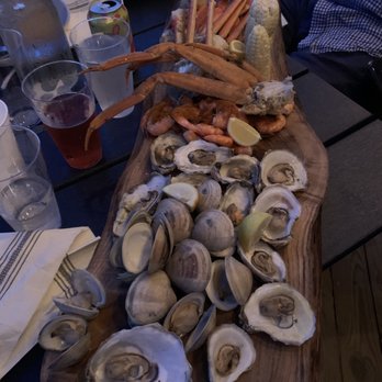 NC Coast Grill & Bar - Underboard - 2lbs of crab, 1 lb of shrimp, a dozen clams and a dozen oysters - New American Near Me - Kitty Hawk, North Carolina NC Coast Grill & Bar - Underboard - 2lbs of crab, 1 lb of shrimp, a dozen clams and a dozen oysters - New American Near Me - Kitty Hawk, North Carolina