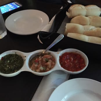 Rincon Porteño - Warm bread and chimichuri, tomato/ onion, & roasted red pepper for dipping - Argentine Near Me - Miami, Florida