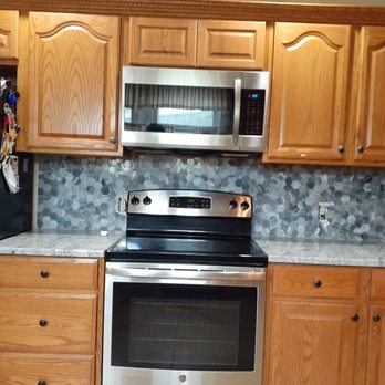 Stone Center Online - a kitchen with stainless steel appliances - Flooring Near Me - Anaheim, California Stone Center Online - a kitchen with stainless steel appliances - Flooring Near Me - Anaheim, California
