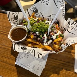 Gage Bowl - Carne asada fried + guac and sour cream (extra cost) = $16