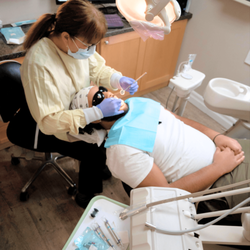 Dr. R Kaur Family Dentistry - Experienced Dentist Performing Dental Treatment