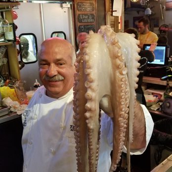 Tin Fish - Chef Joseph Mellusa, owner and creator of Tin Fish, about to prepare fresh Octopus. - New American Near Me - Sunrise, Florida Tin Fish - Chef Joseph Mellusa, owner and creator of Tin Fish, about to prepare fresh Octopus. - New American Near Me - Sunrise, Florida