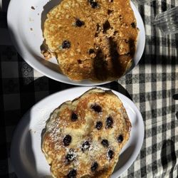 Inn On Coventry - Crunch berry pancake (top) and lemon ricotta pancakes with blueberries.