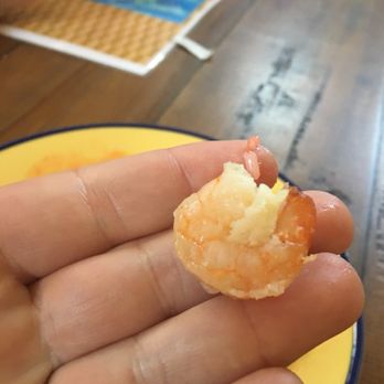 Hot Wok - a hand holding a piece of food - Chinese Near Me - Purcellville, Virginia