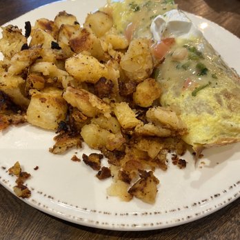 First Watch - Chikichanga omelette with potatoes. Also comes with fresh fruit but not pictured. - Breakfast & Brunch Near Me - Simpsonville, South Carolina First Watch - Chikichanga omelette with potatoes. Also comes with fresh fruit but not pictured. - Breakfast & Brunch Near Me - Simpsonville, South Carolina