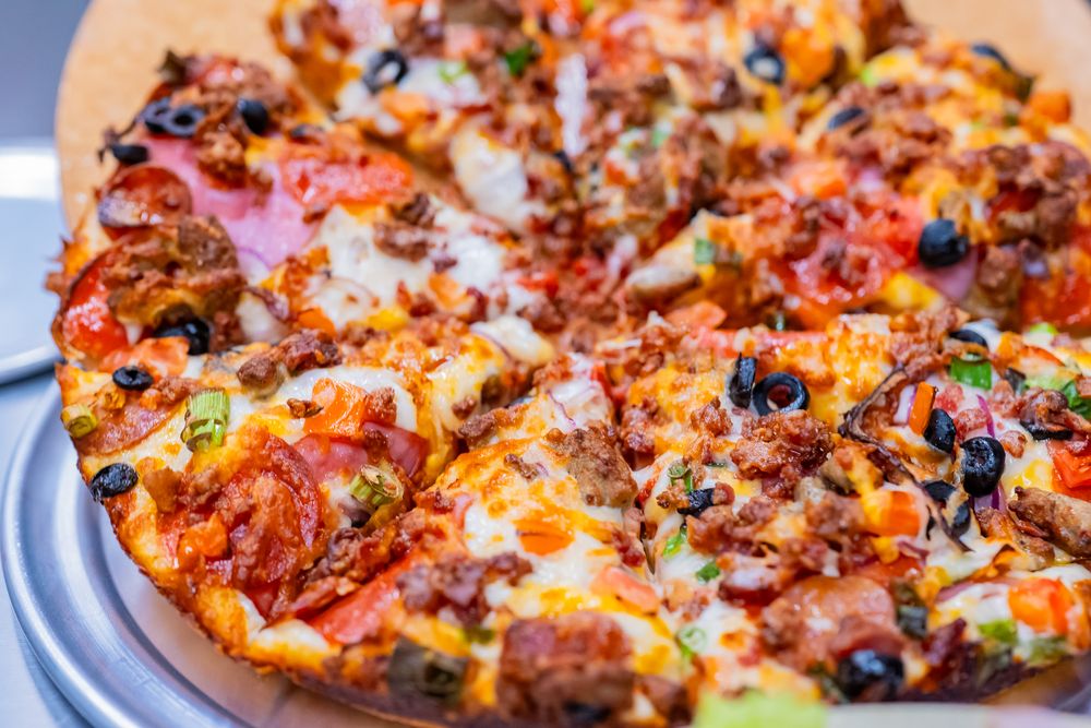 Coconut Kenny's Pizza - Burlington Logo