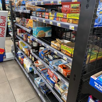 RaceTrac - a grocery aisle with a variety of food items - Gas Stations Near Me - Okeechobee, Florida