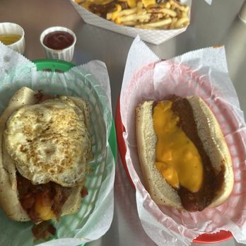 Mustard's Last Stand - Chili cheese dog and some cowboy dog with a fried egg! - Hot Dogs Near Me - Melbourne, Florida Mustard's Last Stand - Chili cheese dog and some cowboy dog with a fried egg! - Hot Dogs Near Me - Melbourne, Florida