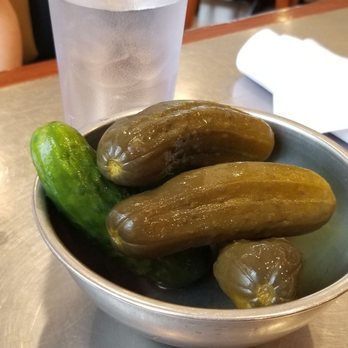 Rye Ridge Deli - Pickles on the house.  Sweet, dilly and crispy fresh snappy mouth goodness. New York water in the background. Ice cold. - Delis Near Me - Rye Brook, New York