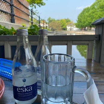 Mex & Co - a bottle of water and a glass of water - Mexican Near Me - Perth, Ontario