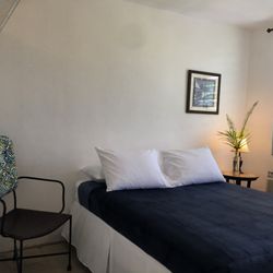 Tropical Guest House - Room with Queen bed. Garden View. Sleeps 2