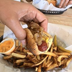 Wrigleyville Grill - In my hands, the "Maxwell Street Polish Sausage Combo Meal" The other picture is what is is SUPPOSED to be... especially for the cost
