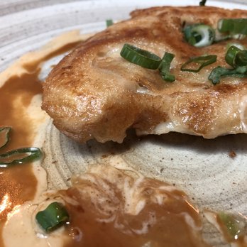 Kona Cafe - Pot Sticker - this was about 5 pot stickers combine by adding a batter and frying. Really good. - Sushi Bars Near Me - Lake Buena Vista, Florida Kona Cafe - Pot Sticker - this was about 5 pot stickers combine by adding a batter and frying. Really good. - Sushi Bars Near Me - Lake Buena Vista, Florida