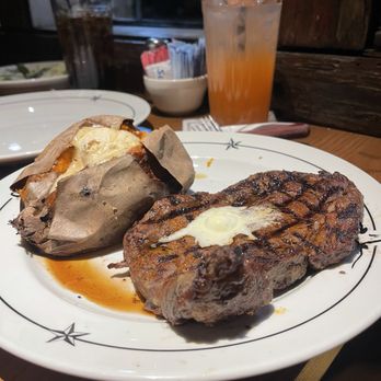 Saltgrass Steak House - Our friends split a 16 oz ribeye with a baked sweet potato...served with cinnamon butter - Steakhouses Near Me - Galveston, Texas