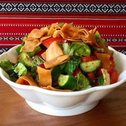 Petra Palace Restaurant - Fattoush Salad, lettuce, diced tomato, cucumber, capsicum, radish, onion, sumac, lemon juice & olive oil, topped with crispy Lebanese bread.