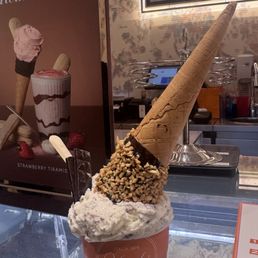 Pistachio gelato with chocolate nut dipped cone
