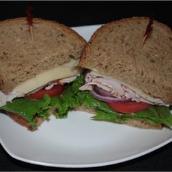 Cracked black pepper turkey breast, swiss, lettuce, tomato, onion and honey mustard