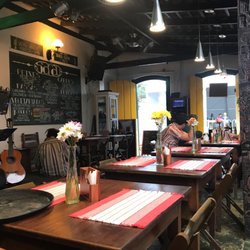 Sarau - They have indoor & outdoor seating. They play samba music & have live musicians. Alcohol available. Very cute venue and friendly staff.