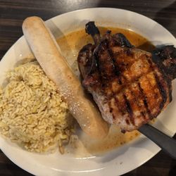 The Grill - Pork chops (Cajun seasoning) w/ rice pilaf and mac n cheese.