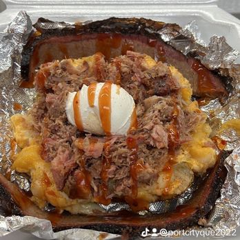 Port City Que - an open container of food - Food Trucks Near Me
