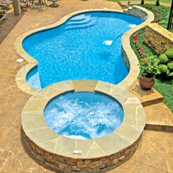 Blue Haven Pools & Spas - Concrete (gunite/shotcrete) pool with elevated spa, raised bond-beam (wall), and twin cascade water features