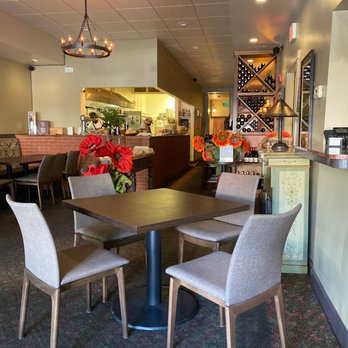 Valenti & Co - a dining area with tables and chairs - Italian Near Me - San Anselmo, California