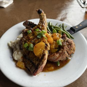 Gruene River Grill - Jalapeño Mandarin Pork Chop - American Near Me - New Braunfels, Texas Gruene River Grill - Jalapeño Mandarin Pork Chop - American Near Me - New Braunfels, Texas