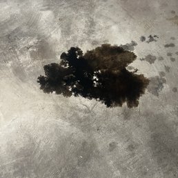 Spilled oil from a poorly sealed drain plug