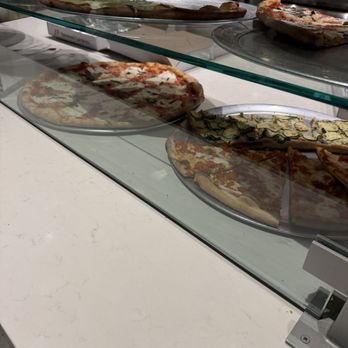 L&B Spumoni Gardens - Counter - selection of slices - Pizza Near Me - Brooklyn, New York L&B Spumoni Gardens - Counter - selection of slices - Pizza Near Me - Brooklyn, New York