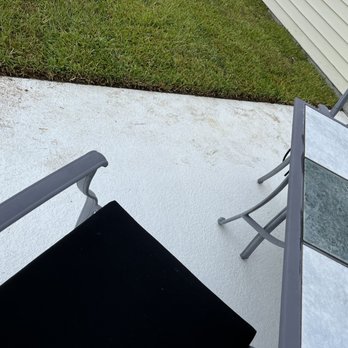 Tidewater Landscape - a chair and table on a patio - Landscaping Near Me - Mount Pleasant, South Carolina